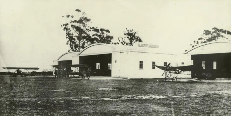 Black and white photograph of the hangars containing Caudron planes at the Canterbury Aviation Company