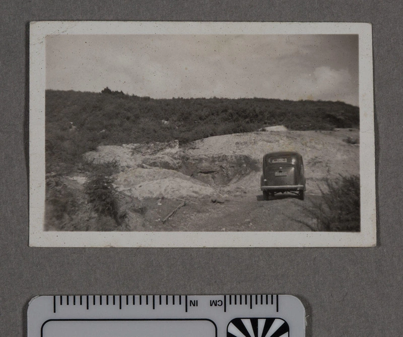 Photograph - Car parked by a clay quarry in countryside
