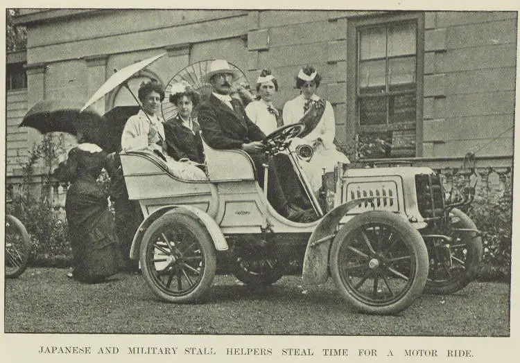 Japanese and military stall helpers steal time for a motor ride
