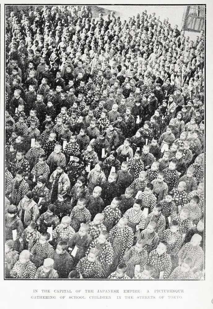 In the capital of the Japanese Empire: a picturesque gathering of school children in the streets of Tokyo