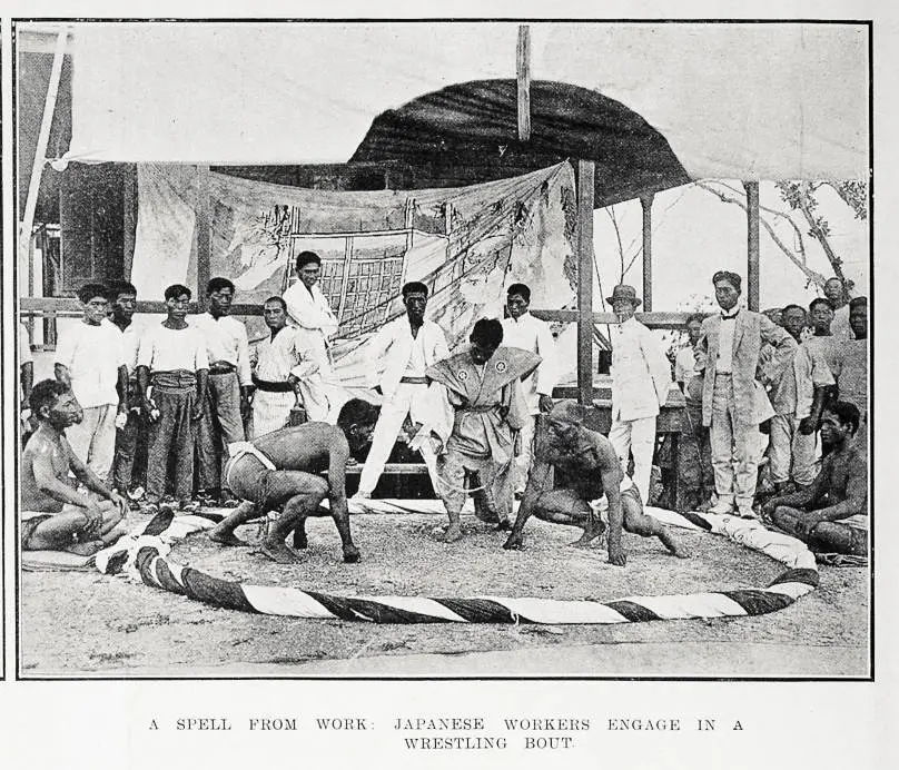 A spell from work: Japanese workers engage in a wrestling bout