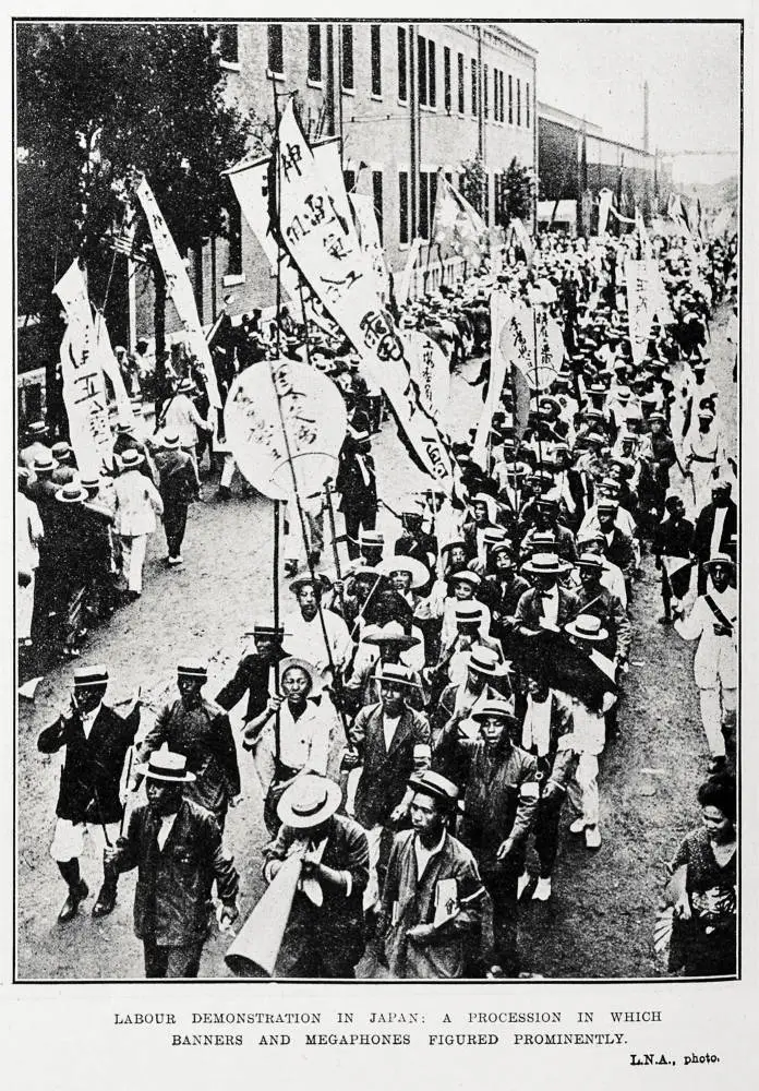 Labour demonstration in Japan: a procession in which banners and megaphones figured prominently