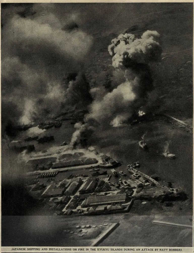 Japanese shipping and installations on fire in the Ryukyu islands during at attack by navy bombers
