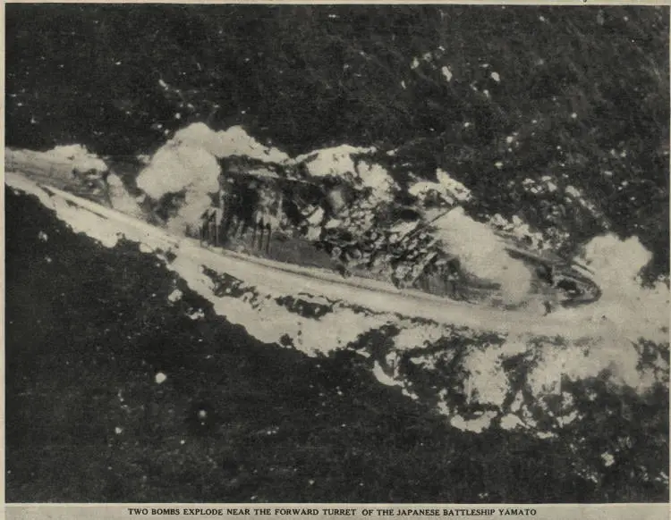 Two bombs explode near the forward turret of the Japanese battleship, Yamato