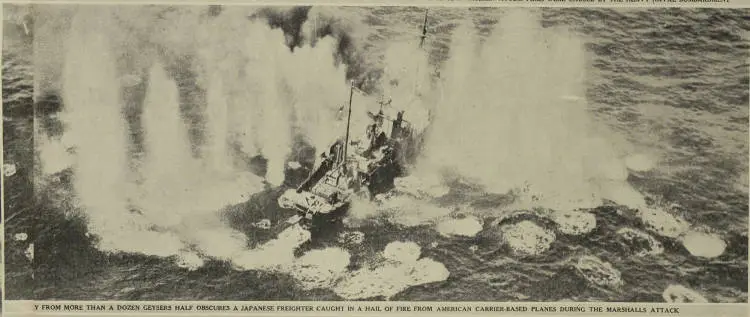 Spray from more than a dozen geysers half obscures a Japanese freighter caught in a hail of fire from American carrier-based planes during the Marshalls attack