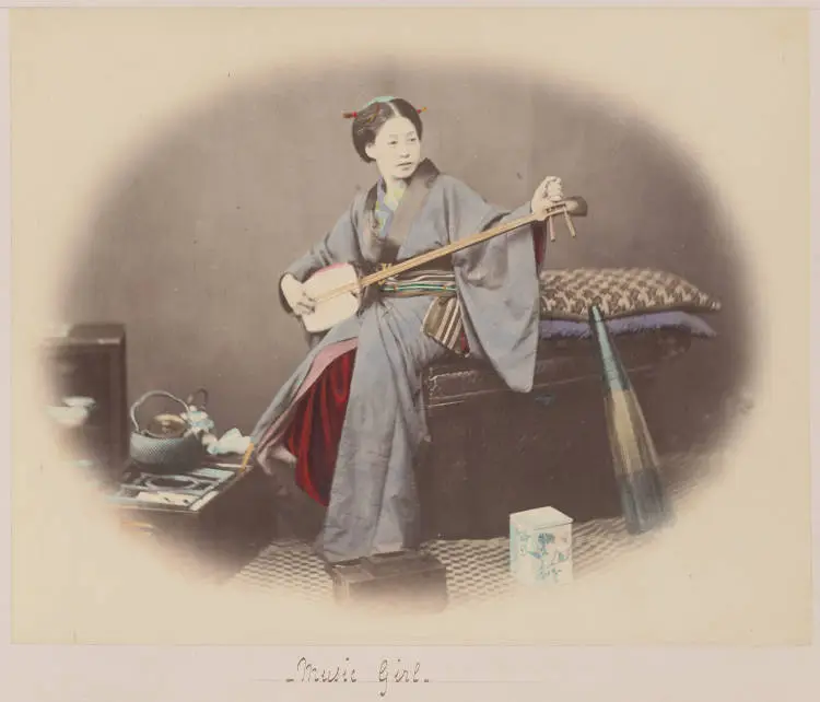 Japanese woman holding a shamisen