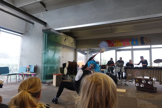 The cat from Japan waved a big blue fan