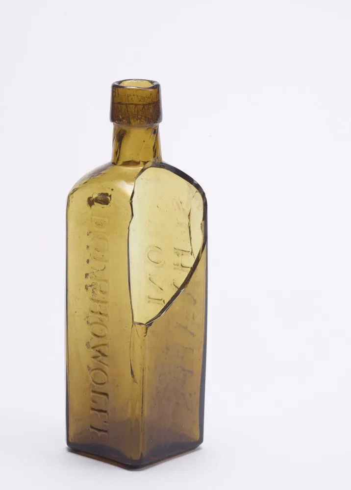 Bottle Yellow glass with 'Aromatic Schnapps' Record DigitalNZ