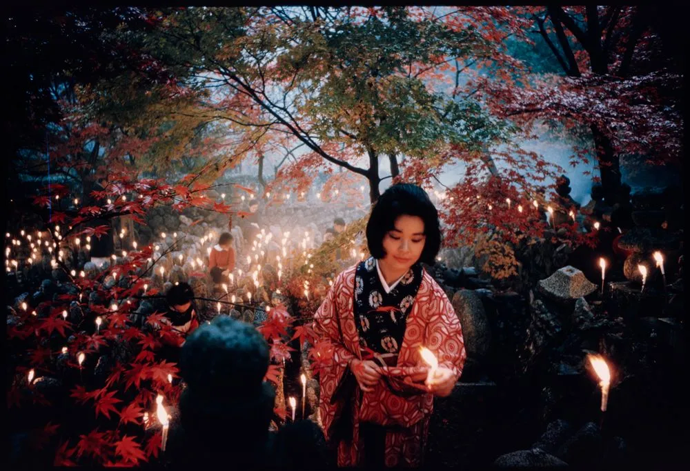 'Offerings to the unknown dead, Kyoto' [Toshi Satow offering a candle]. Taken for a series on Japan for 'Life'