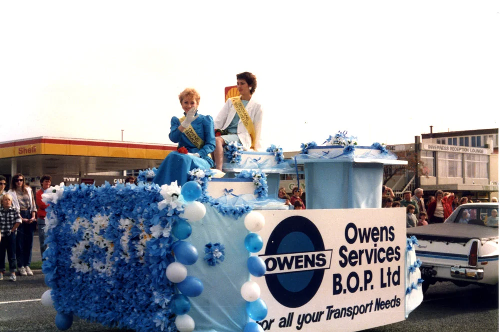 Beauty queens in float parade 1980s
