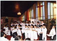 Children perform at Glen Eden Pacific Islanders Church during a White Sunday service, 2002