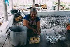 Woman cooking, Fakaofo, Tokelau