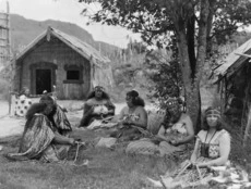 Māori women weaving flax