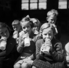School girls drinking milk