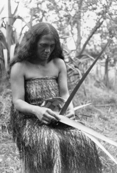 Māori woman weaving
