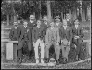Unidentified group of men, all members wear a rosette pinned to their lapel, in an outdoor location, probably Christchurch district