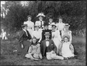 Unidentified group of women and girls outdoors, many wearing hats, probably Christchurch district, including a man in the front