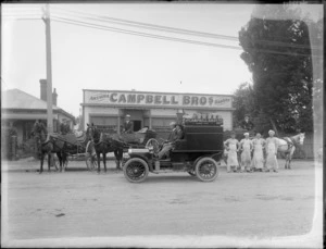 Exterior view of Campbell Brothers Bakery, [Antigua Street, Christchurch?] showing staff, horses and carriages and delivery van