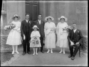 Shows unidentified wedding party outside St Paul's Presbyterian Church, Christchurch.