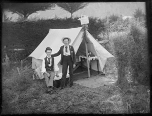 Two unidentified men in front of tent named 'Violet Camp', Christchurch