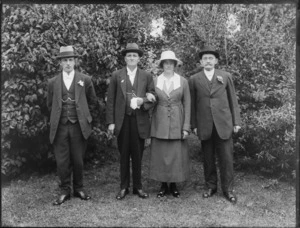 Group, showing three men and a woman, all unidentified, in a garden, possibly Christchurch district