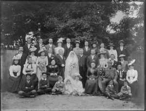 Wedding group, including unidentified men, women and children, in an outdoor location, possibly Christchurch district