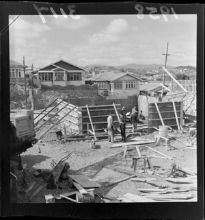 Unidentified men working on the construction site of the control tower at Rongotai Airport, Wellington