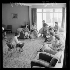 Unidentified group of female students in the lounge relaxing, Victoria House, Kelburn, Wellington