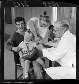 An unidentified child with his father getting a polio vaccination at Titahi Bay