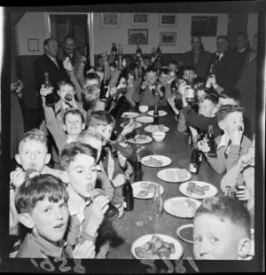 Hutt Valley and Wellington rugby union football bantam teams eating a meal in a clubroom