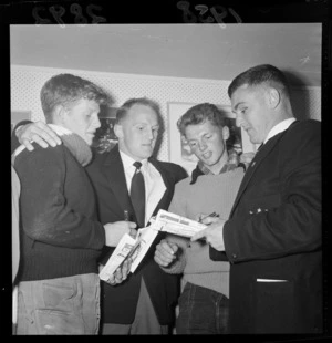 Boys collecting autographs from W J Whineray and C Wilson