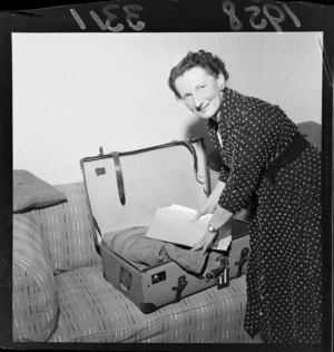 Member of Parliament Mrs Ethel McMillan packing her suitcase, Wellington