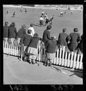 Unidentified team watching a game of women's hockey, Basin Reserve, Wellington