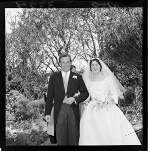 Wedding portrait of James Hutchison and Margot Todd in unidentified garden on the day of their wedding
