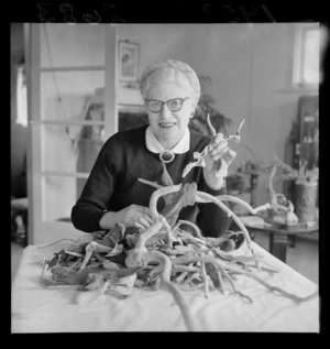 Unidentified woman sorting out driftwood