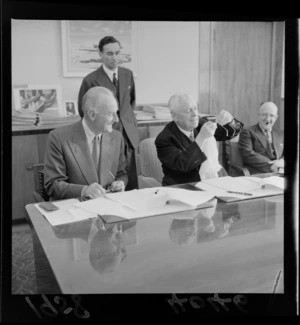 Sir George Mallaby, left, with Walter Nash, signing a trade agreement between New Zealand and the United Kingdom [in office at Parliament?]