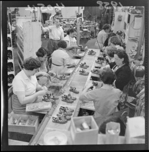 Unidentified female workers assembling plastic shoes at Buchanan and Edwards shoe factory