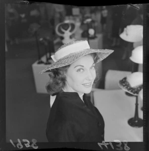 Actress Bettina Welch, modelling a hat at Kirkcaldie and Stains Department Store, Wellington