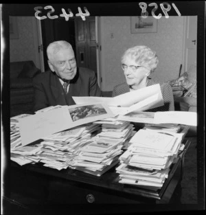 Prime Minister, Sir Walter Nash, and Mrs Nash, looking at Christmas cards