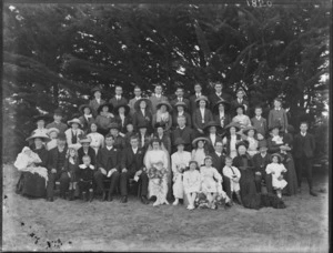 Large unidentified wedding group outdoors, showing bride and groom, wedding party and extended family, probably Christchurch district
