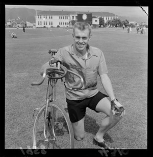 Unidentified cyclist with bicycle, Laykold Cup, Petone, Wellington Region