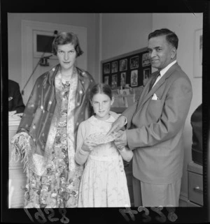 Indian High Commissioner Mr Menan presenting gifts to unidentified girls