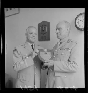 Brigadier-General P H Draper junior presenting a plaque to Major-General Cyril E Weir