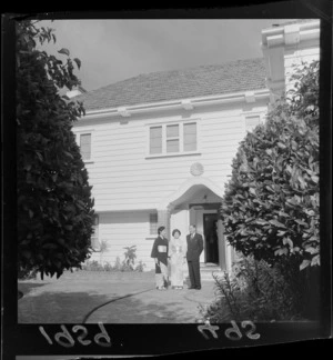 Exterior of official residence of the Japanese ambassador with unidentified man and women by the front door