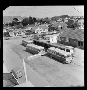 New Zealand Railways Road Services Bus parked at the Lower Hutt Bus Terminal, Wellington Region, including residential houses in background