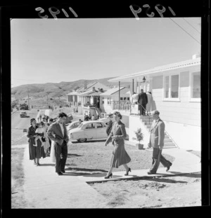 Unidentified people outside house that is part of the Tawa 'Parade of Homes', Wellington