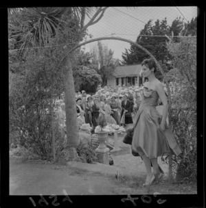 Young woman posing in a strapless dress at a fashion show in the garden at Homewood, Karori, Wellington