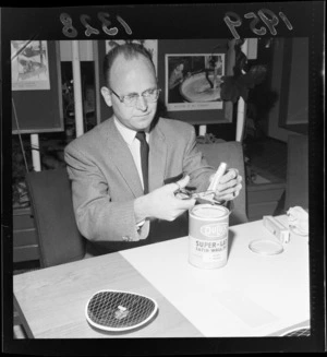 Cutting of tube paint into a paint can at the Dulux Colour Centre