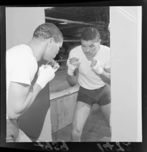 Willie Vaughn (boxer) practicing with a mirror