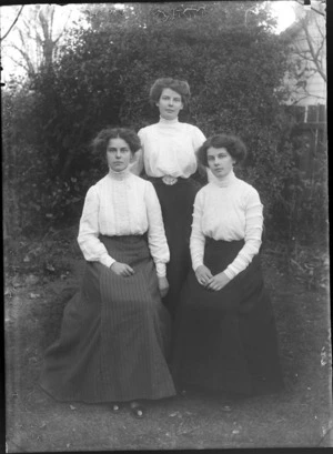 Three unidentified women, in a garden, possibly Christchurch